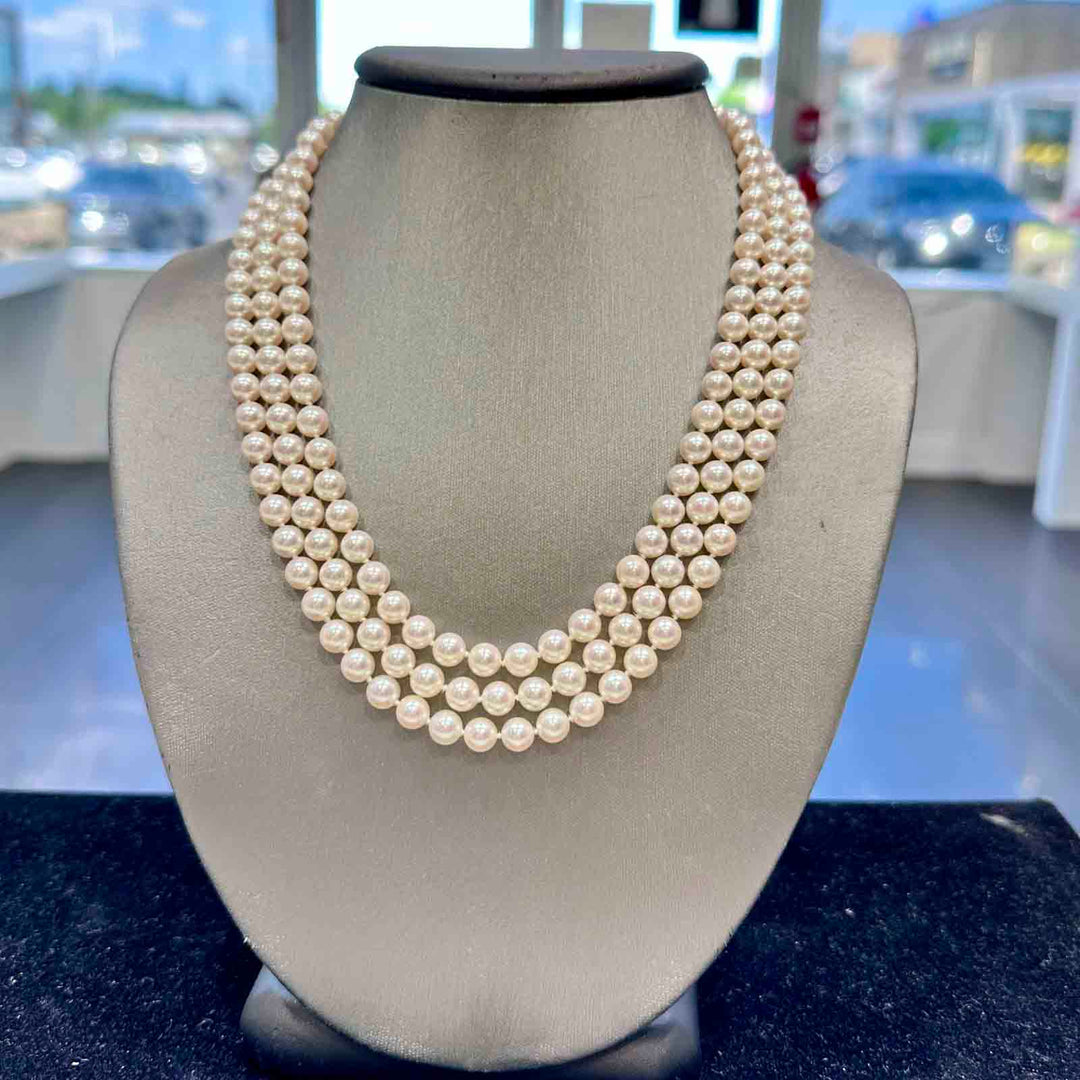 Three-strand Akoya cultured pearl necklace with 6.9-6.5mm AAA quality pearls and 14k clasp.