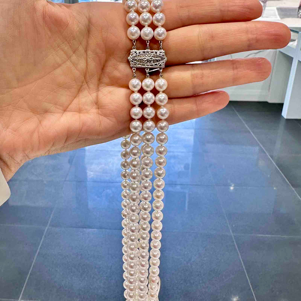 Three-strand Akoya cultured pearl necklace with 6.9-6.5mm AAA quality pearls and 14k clasp.