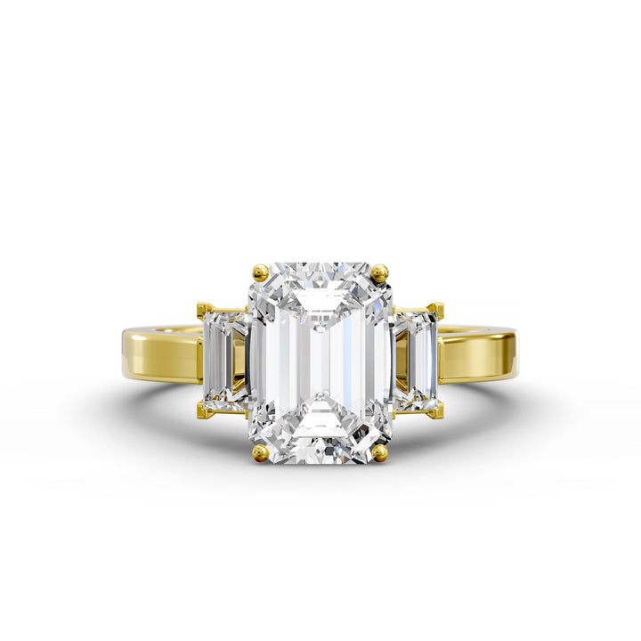 Emerald-cut three-stone diamond engagement ring with matching emerald side stones shown in studio lighting.