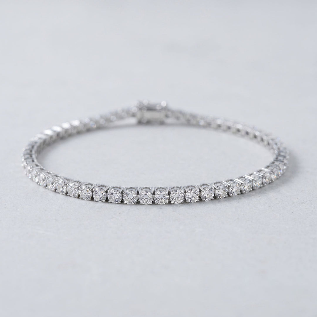Round lab-grown diamond tennis bracelet, oval low-angle studio view