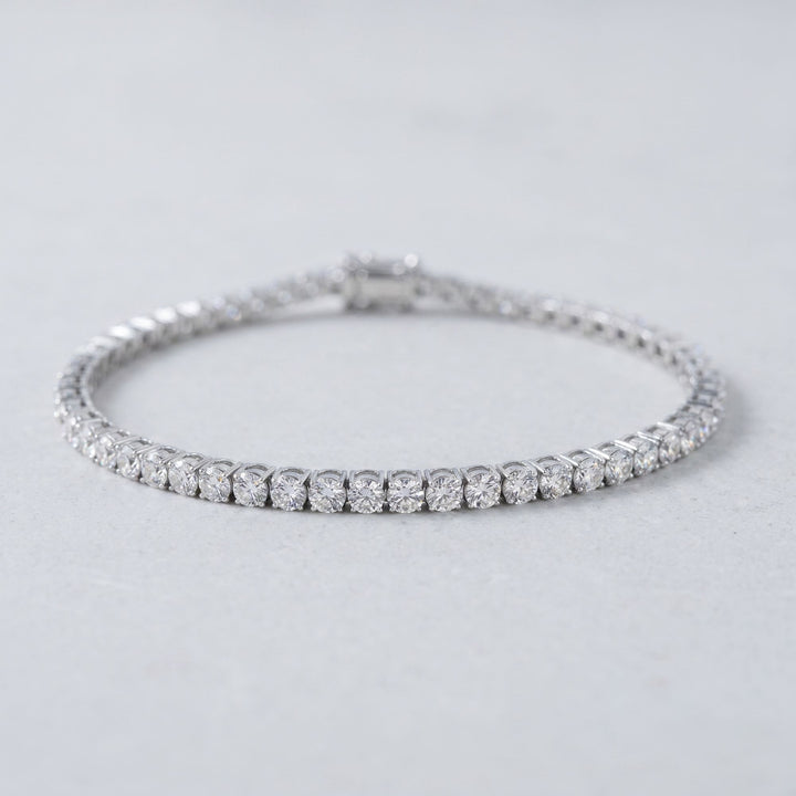 Round lab-grown diamond tennis bracelet, oval low-angle studio view