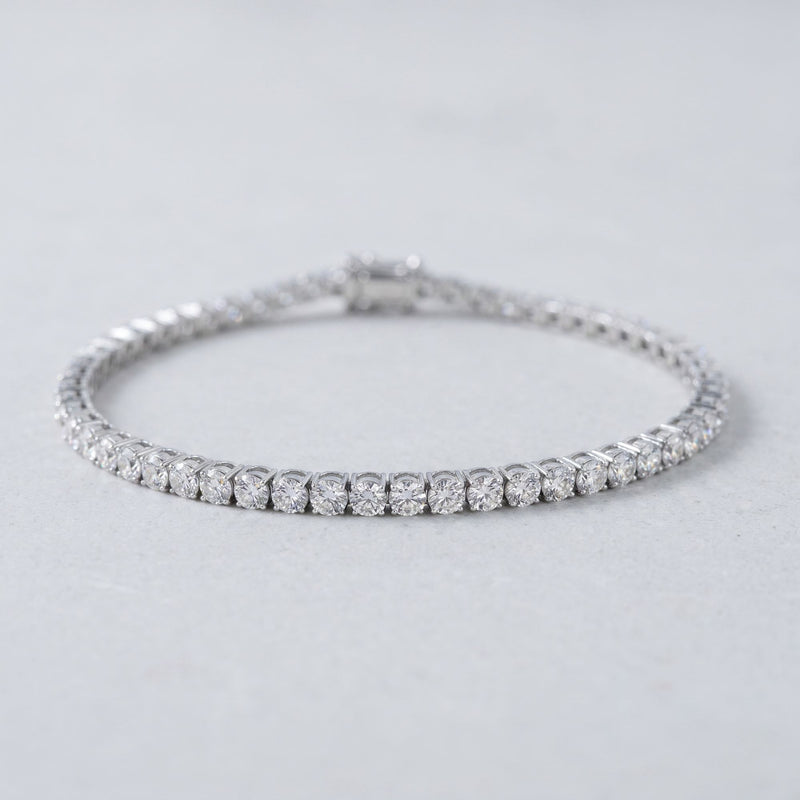 Round lab-grown diamond tennis bracelet, oval low-angle studio view