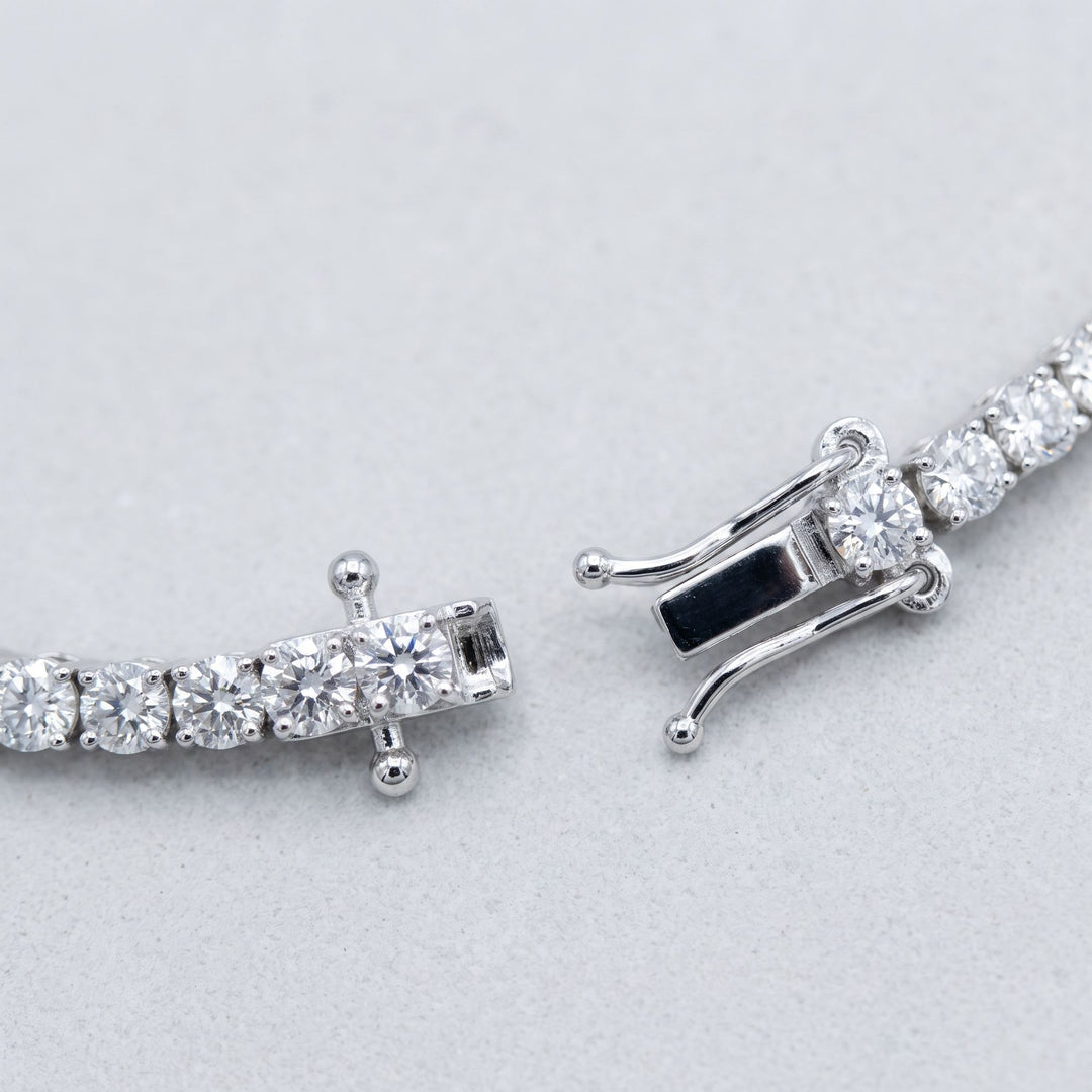 Open tennis bracelet with clasp detail, studio view