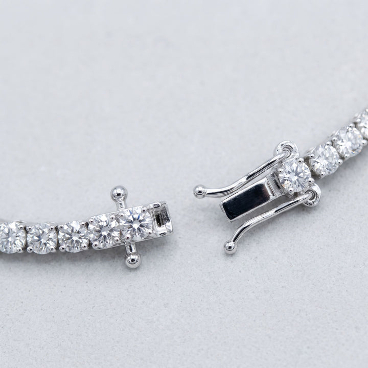 Open tennis bracelet with clasp detail, studio view
