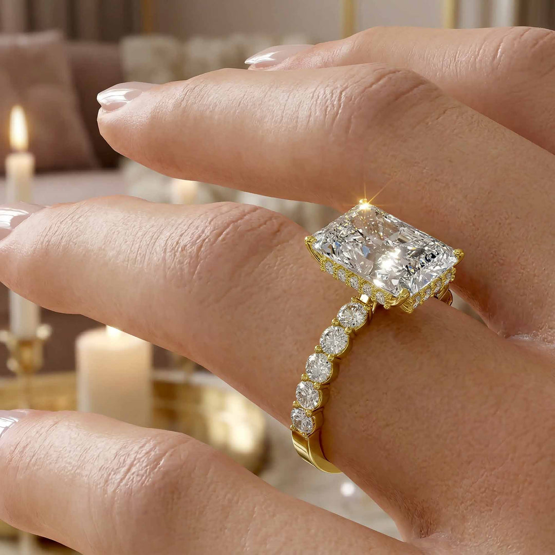 Radiant diamond hidden halo engagement ring with diamonds on band shown in display view.