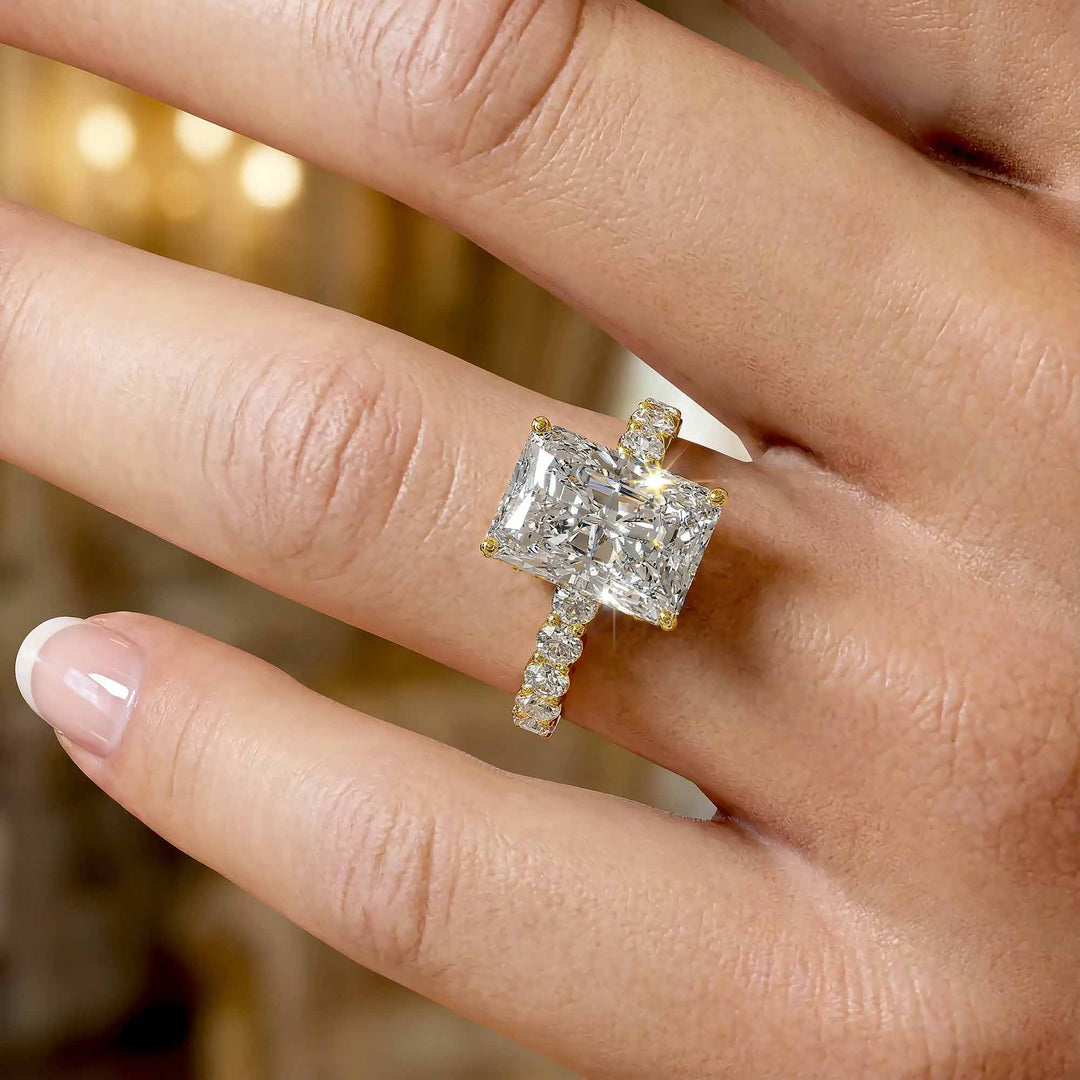 Radiant diamond hidden halo engagement ring with diamonds on band shown in display view.