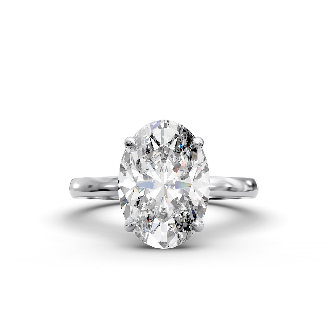 4ct oval diamond hidden halo engagement ring with sleek band in studio lighting.