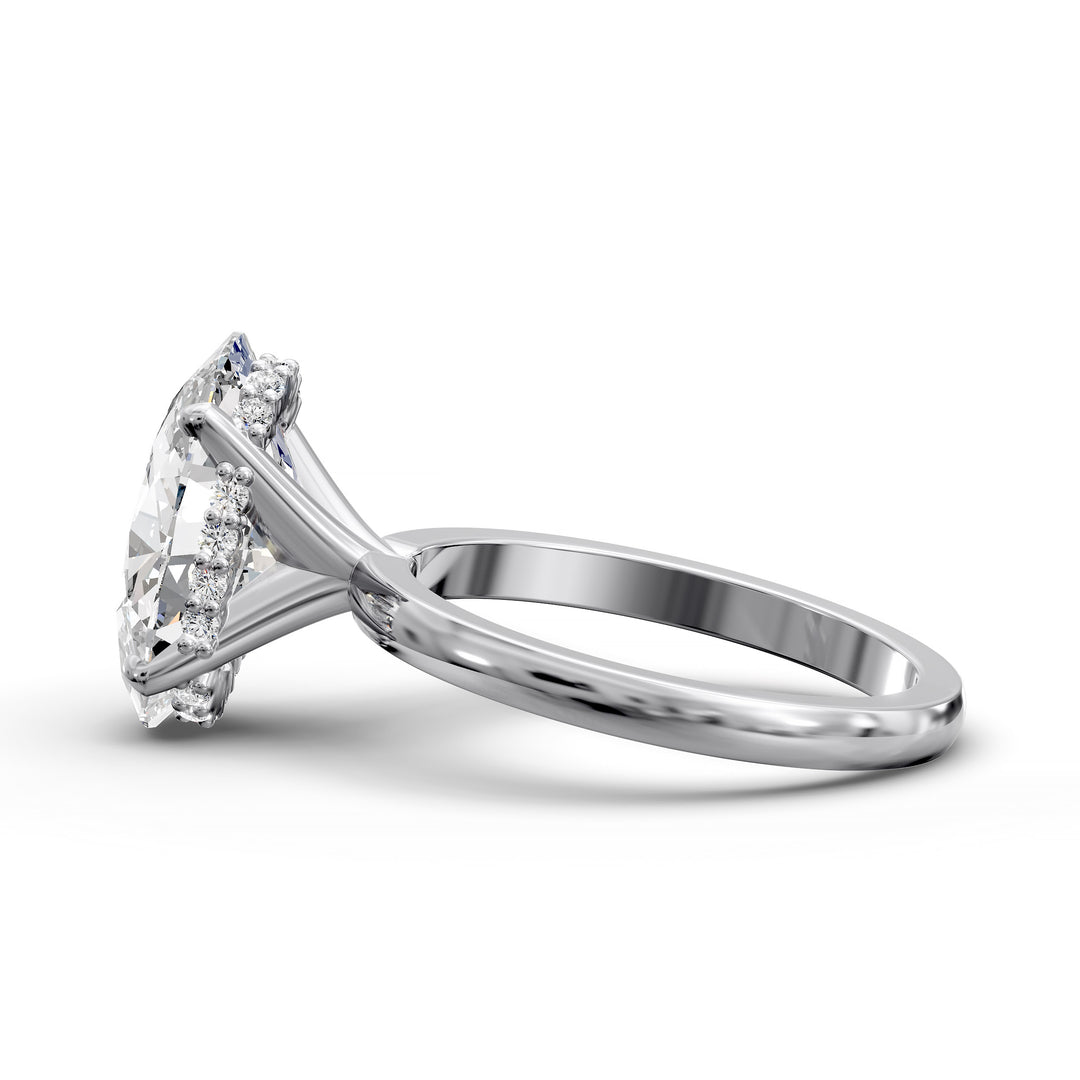 4ct oval diamond hidden halo engagement ring with sleek band in studio lighting.