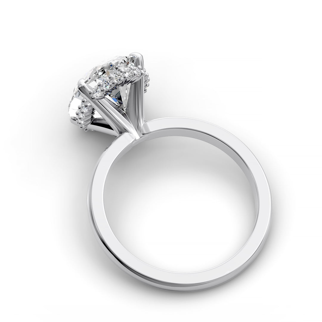 4ct oval diamond hidden halo engagement ring with sleek band in studio lighting.