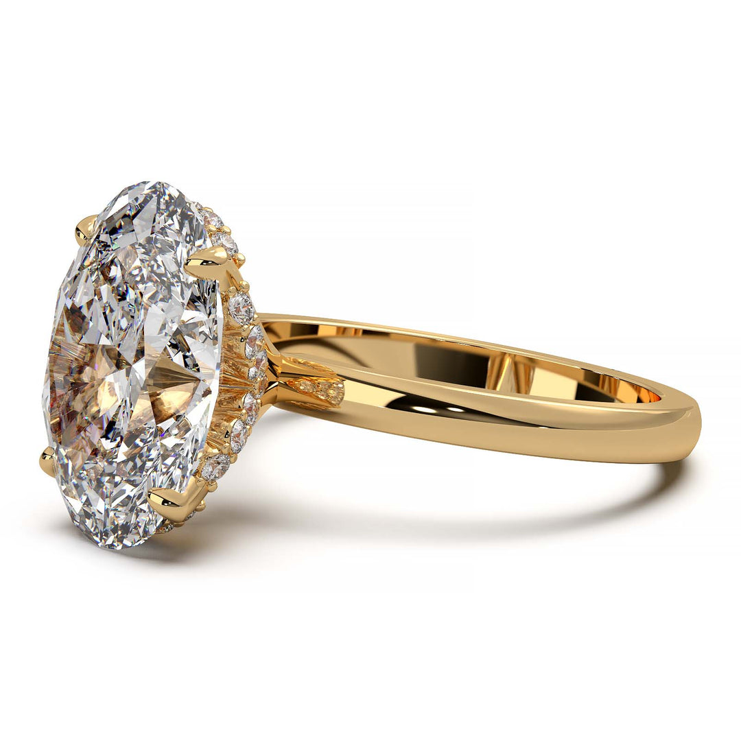 Oval lab-grown diamond engagement ring with hidden halo and low-profile setting.