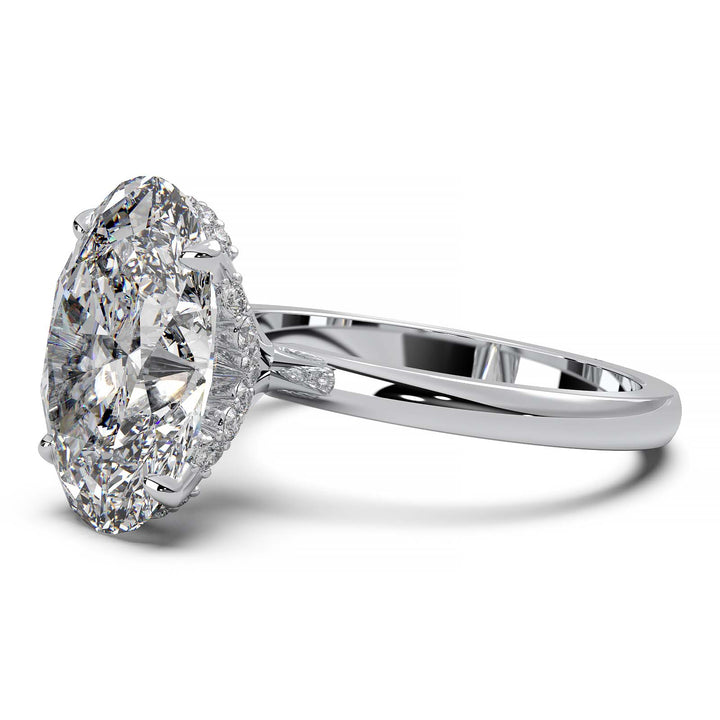 Oval lab-grown diamond engagement ring with hidden halo and low-profile setting.