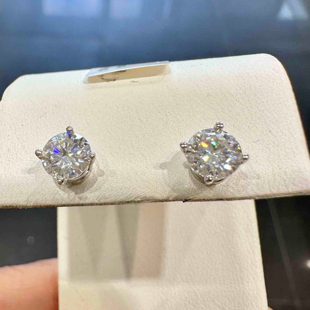 14K white gold stud earrings with 5.5mm colorless moissanite stones and secure screw-back closures, elegant and timeless design.