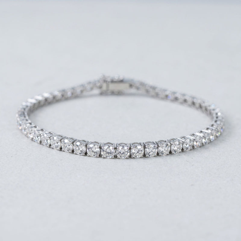 Round lab-grown diamond tennis bracelet, oval low-angle studio view