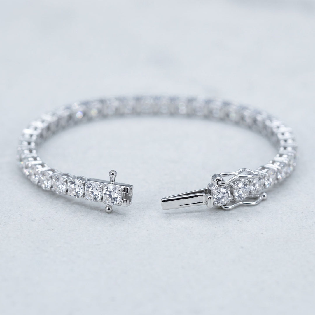 Open tennis bracelet with clasp detail, studio view
