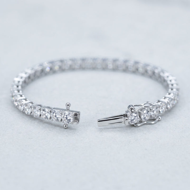Open tennis bracelet with clasp detail, studio view