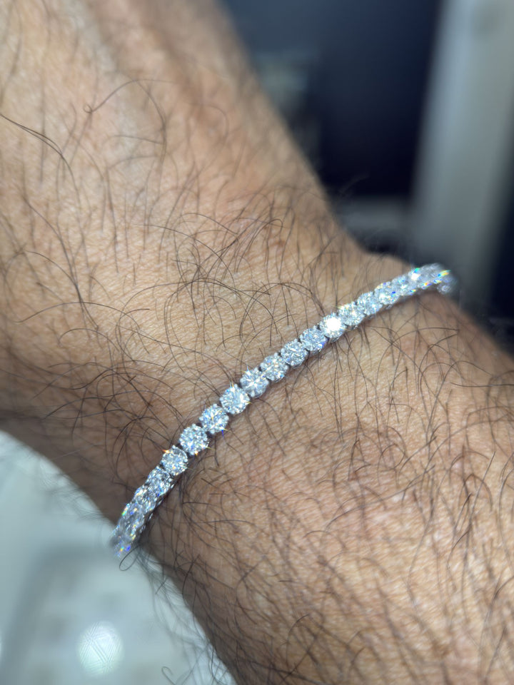 Round lab-grown diamond tennis bracelet shown on a man’s wrist