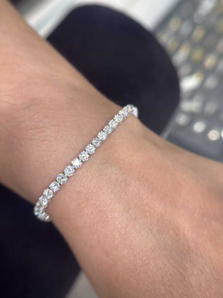 Round lab-grown diamond tennis bracelet on a man’s wrist, second view