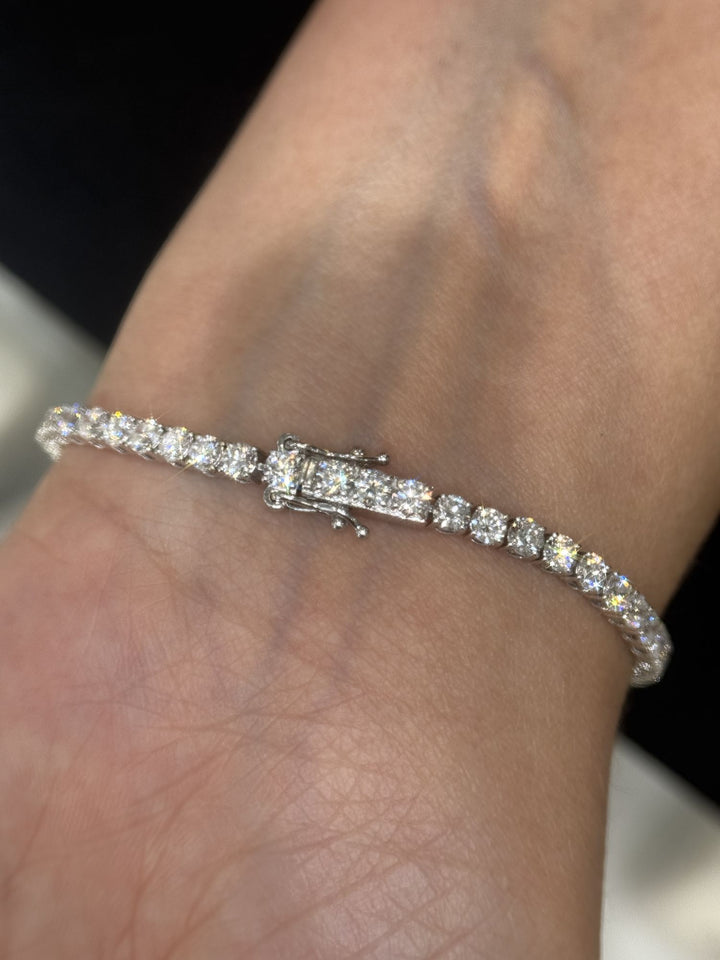 Round lab-grown diamond tennis bracelet shown on a woman’s wrist