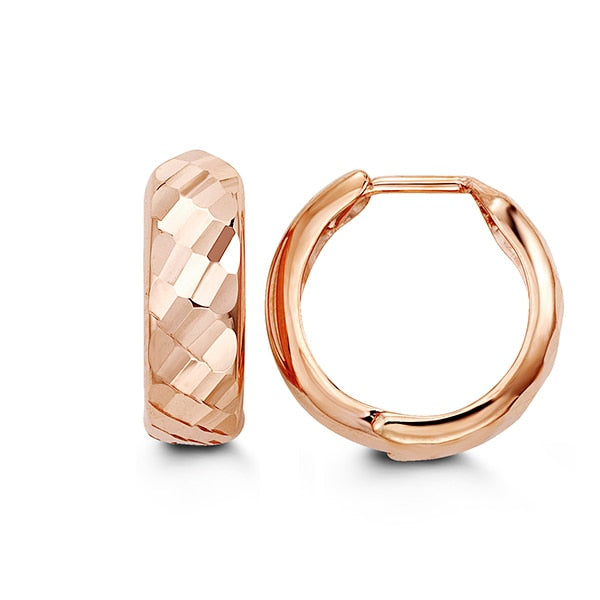 10K rose gold huggie earrings with a textured pattern and hinged closure.