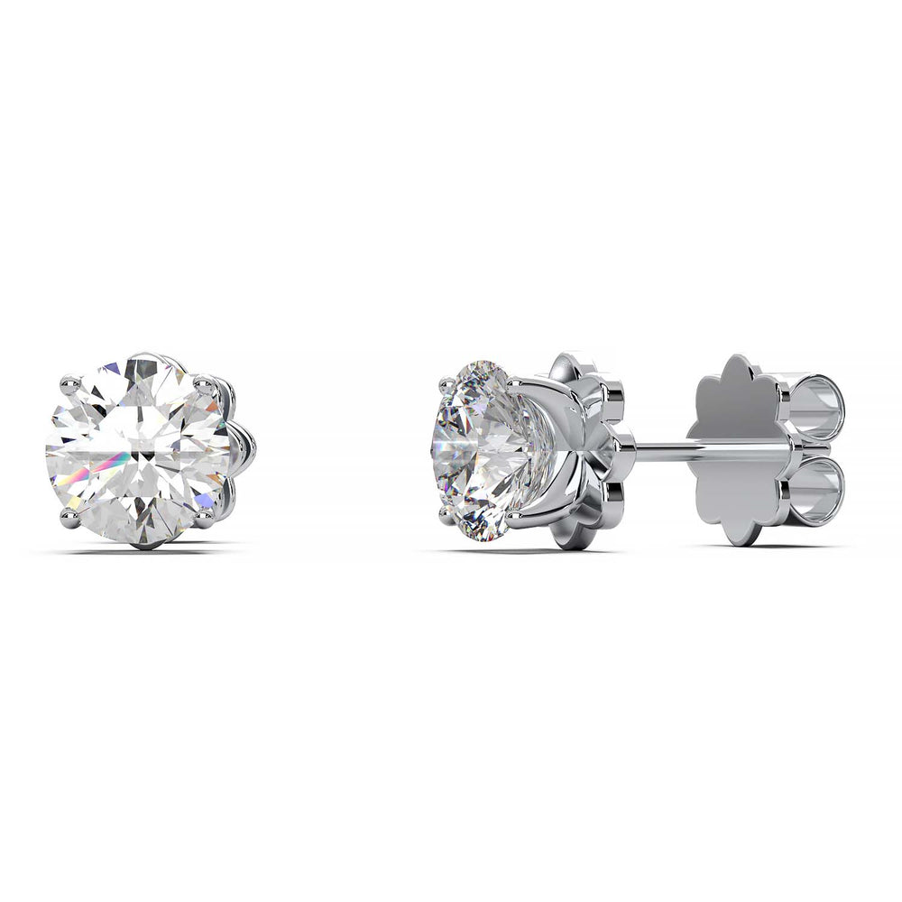 A pair of 1.5 carat total weight diamond stud earrings set in a prong setting