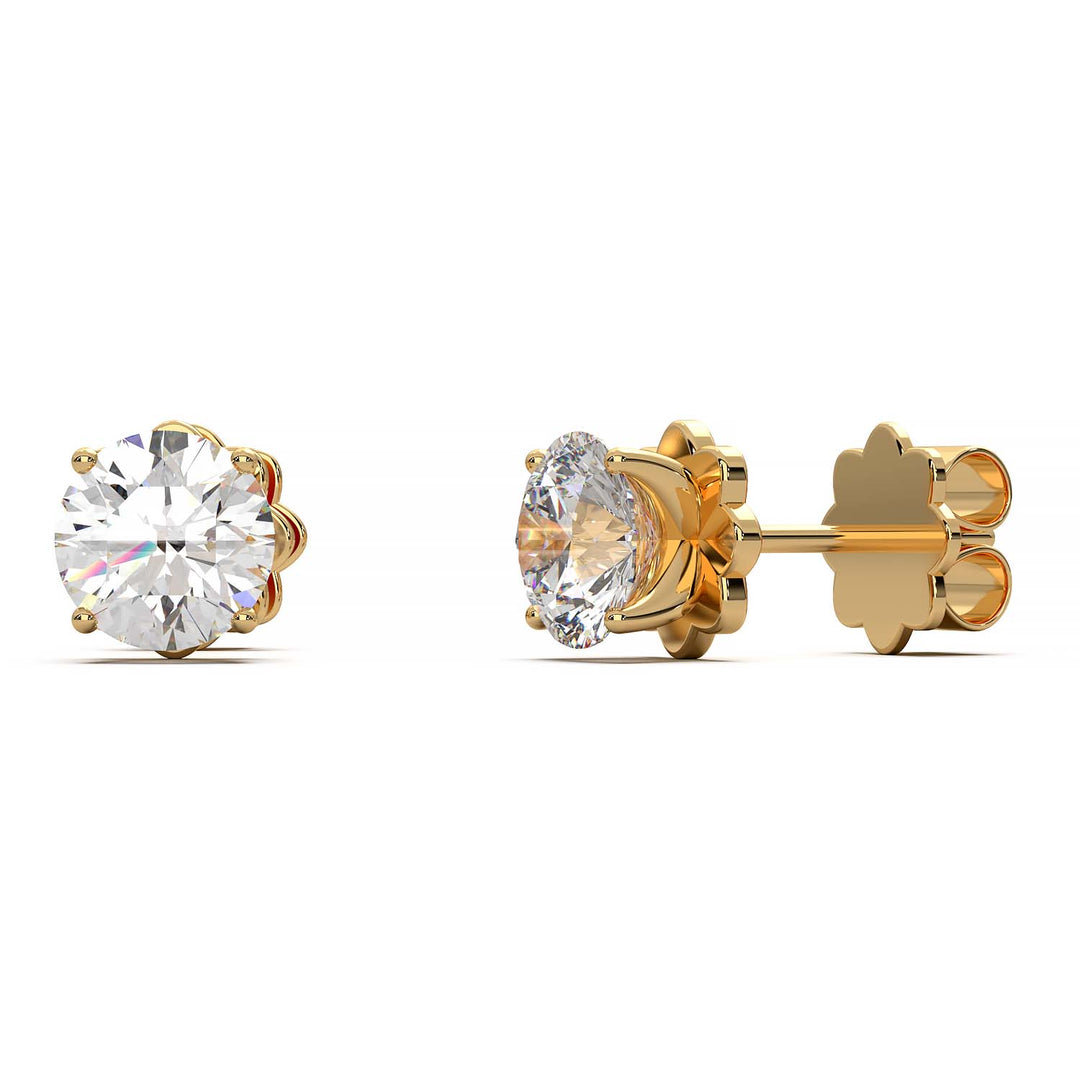 A pair of 1.5 carat total weight diamond stud earrings set in a prong setting