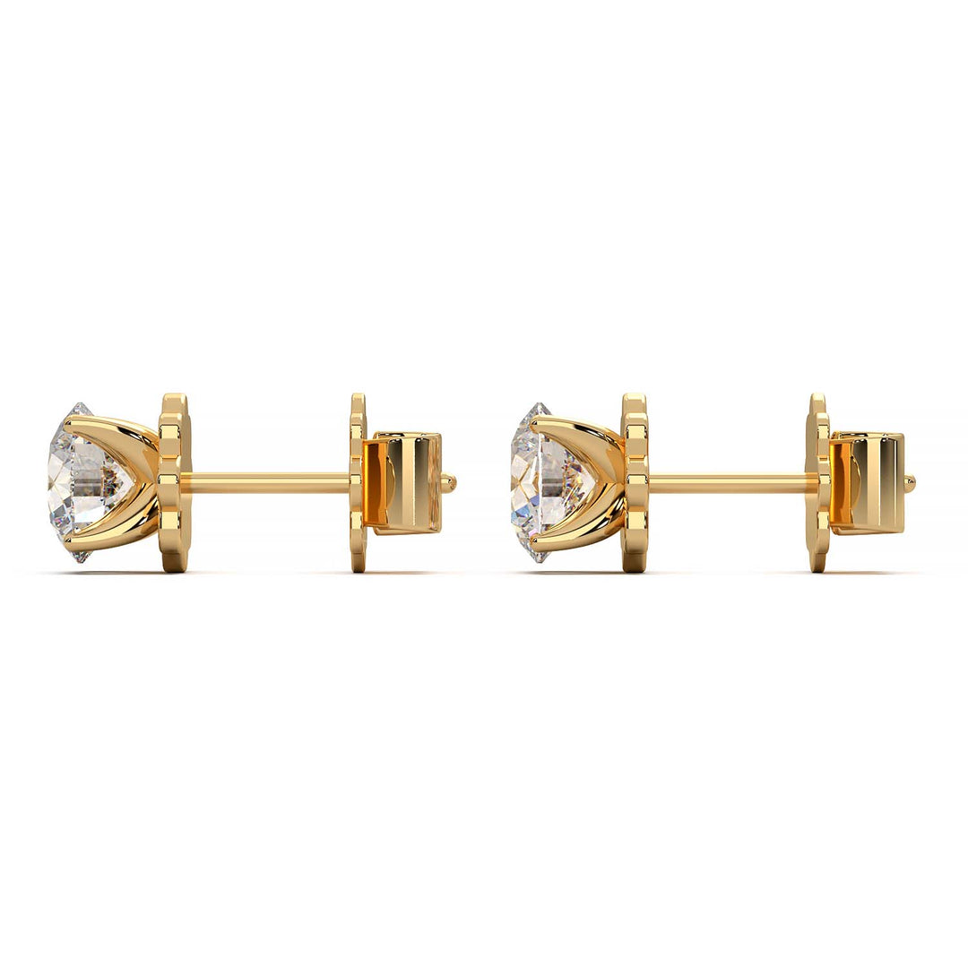 A pair of 1.5 carat total weight diamond stud earrings set in a prong setting