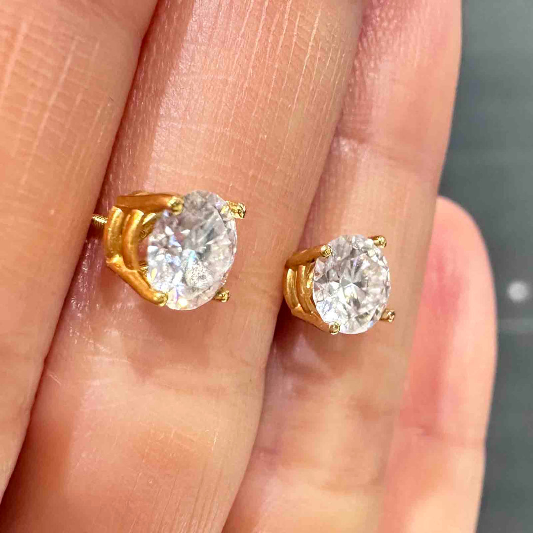 14K yellow gold stud earrings with 6mm colorless moissanite stones and secure screw-back closures, simple and elegant design.