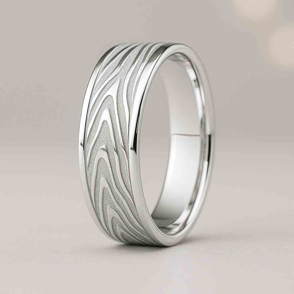 7mm flat gold wedding band with Mokume wood-grain textured matte center and polished edges
