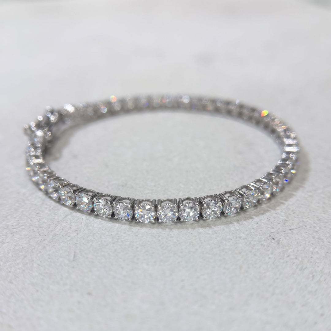 Round lab-grown diamond tennis bracelet, oval low-angle studio view