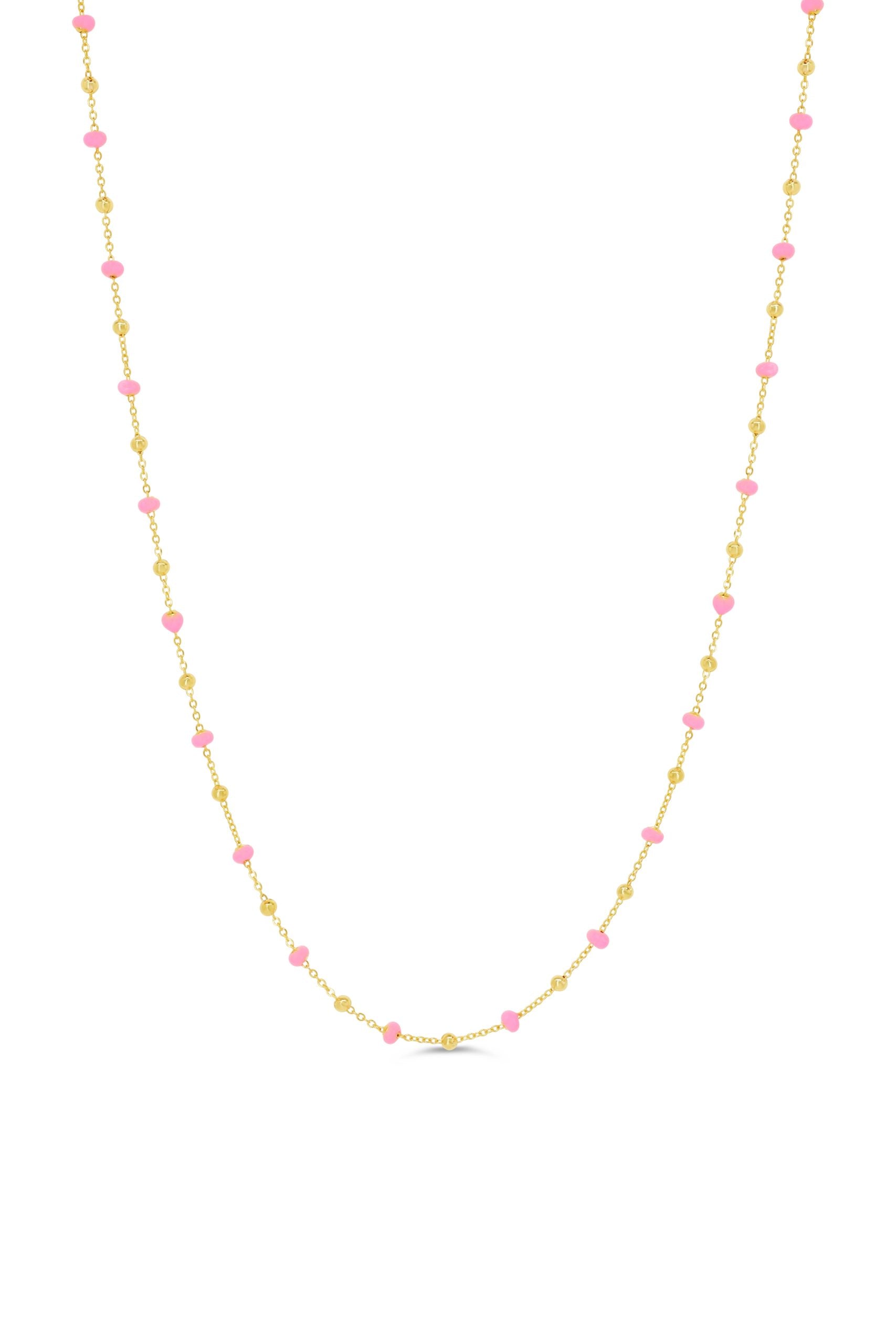 10K yellow gold necklace featuring polished gold beads and pink bead accents on a delicate chain.
