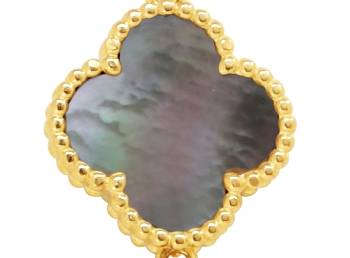 Gold and black mother of pearl four-leaf clover earring with beaded gold detailing.