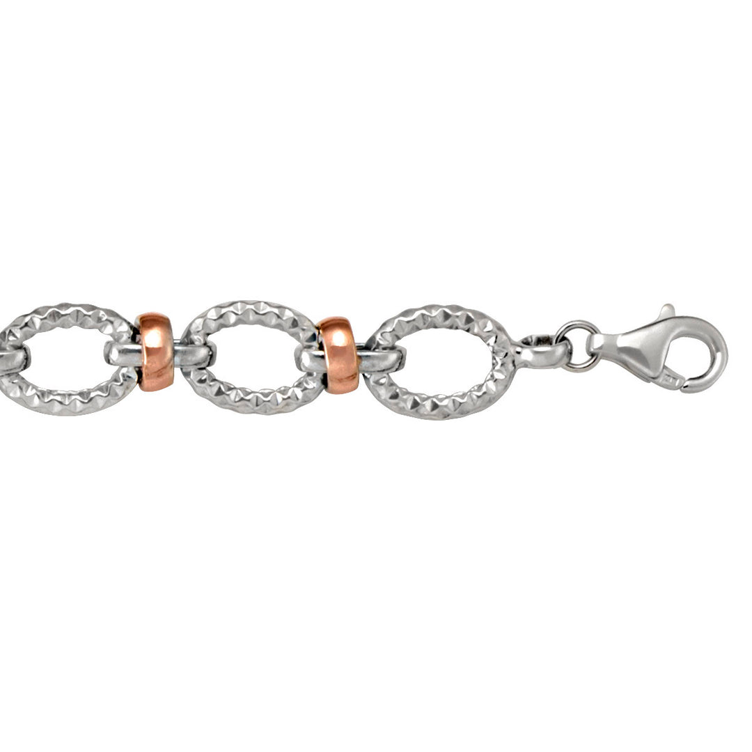 10k rose and white gold hollow link bracelet with a lobster clasp.