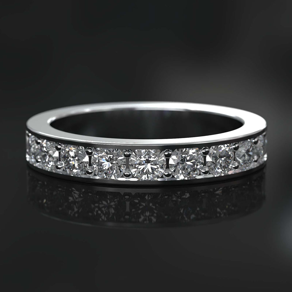 Channel set half eternity wedding band with diamonds.