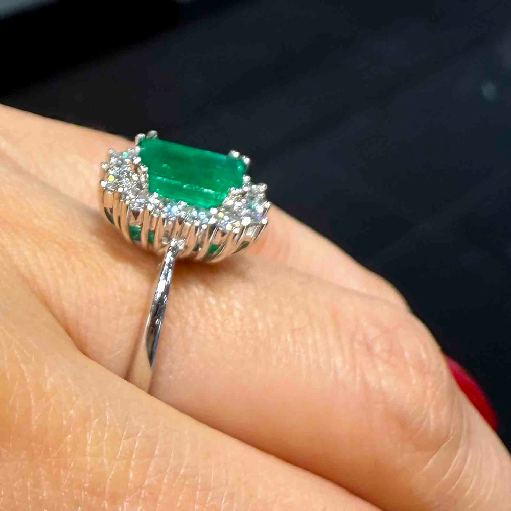 1.25 CT Colombian emerald ring with 0.58 CT diamonds in 14K white gold.