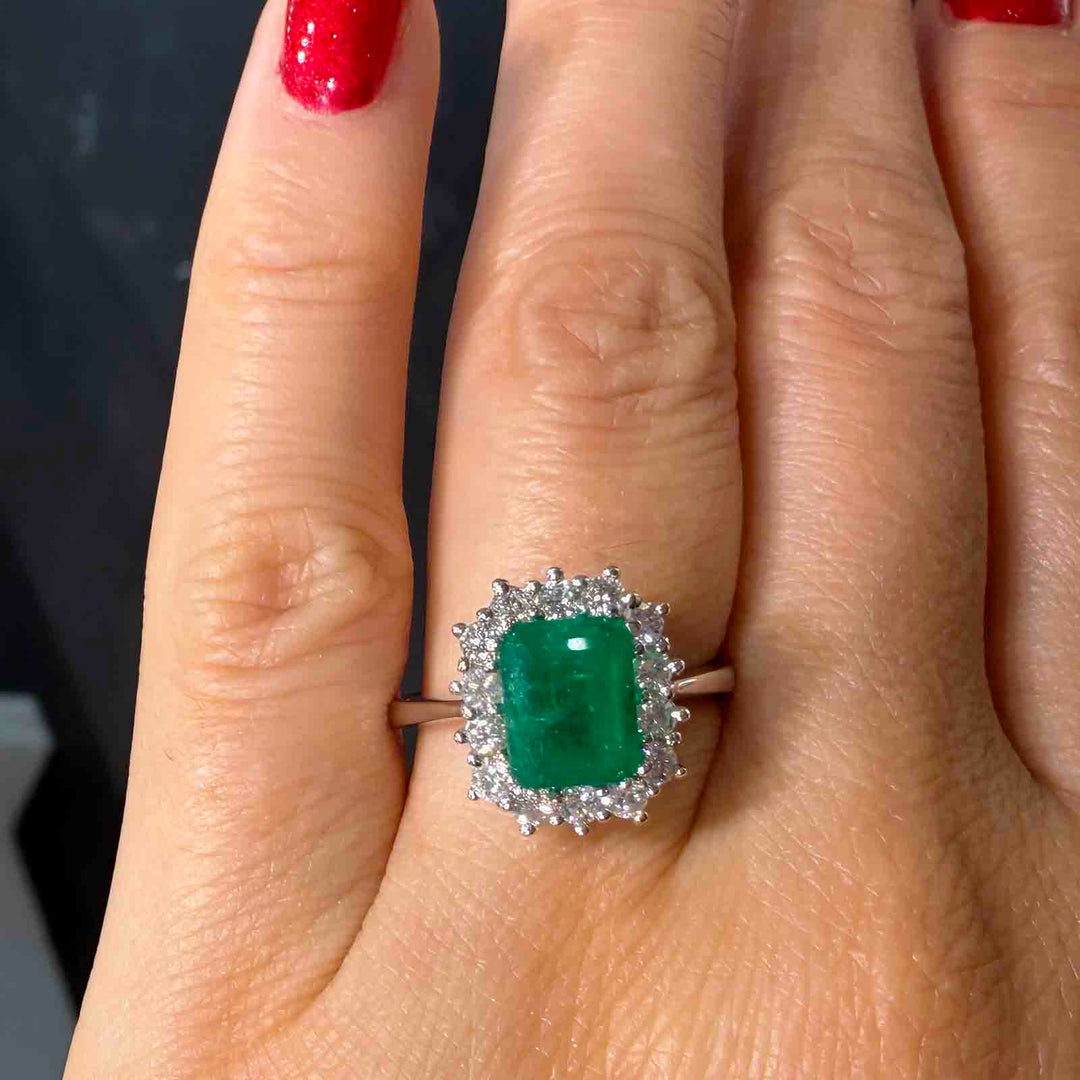 1.25 CT Colombian emerald ring with 0.58 CT diamonds in 14K white gold.