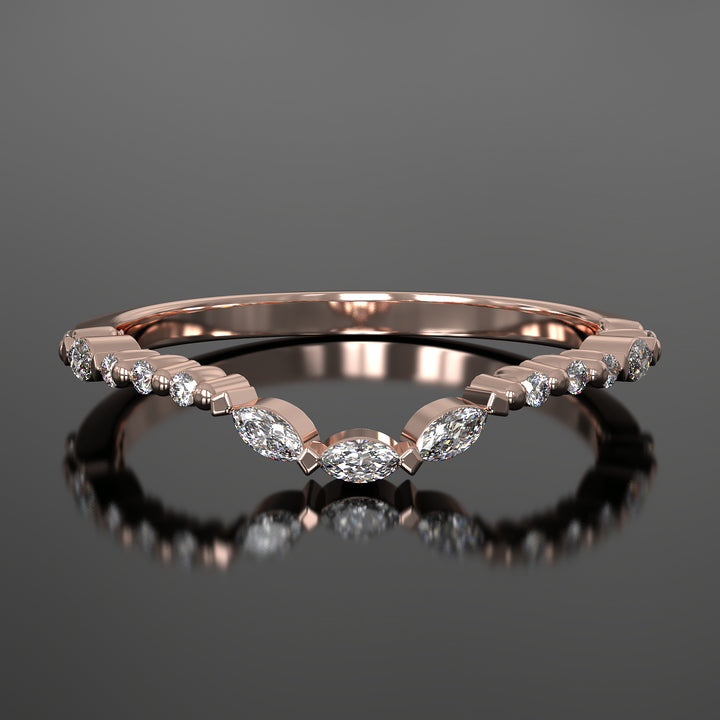 Curved wedding band with marquise and round lab-grown diamonds in a floating design with shared prongs.