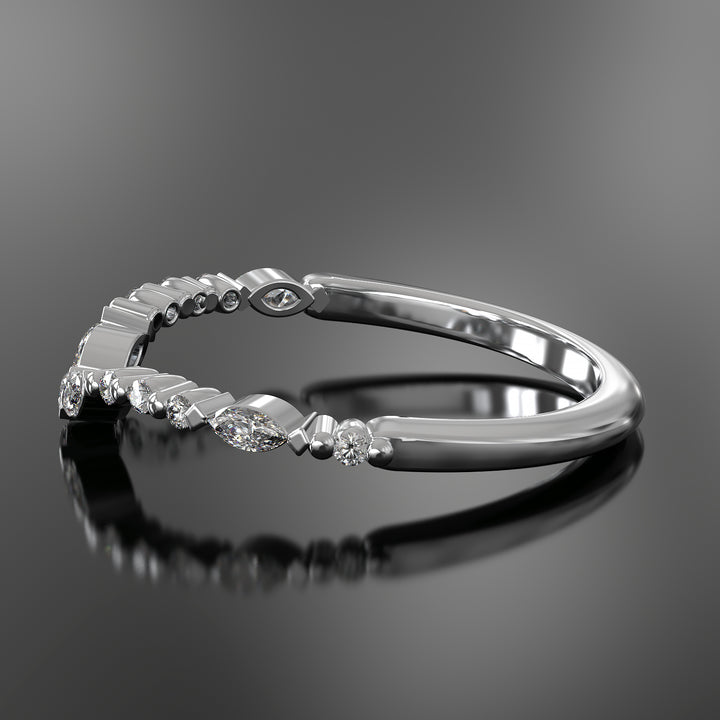 Curved wedding band with marquise and round lab-grown diamonds in a floating design with shared prongs.