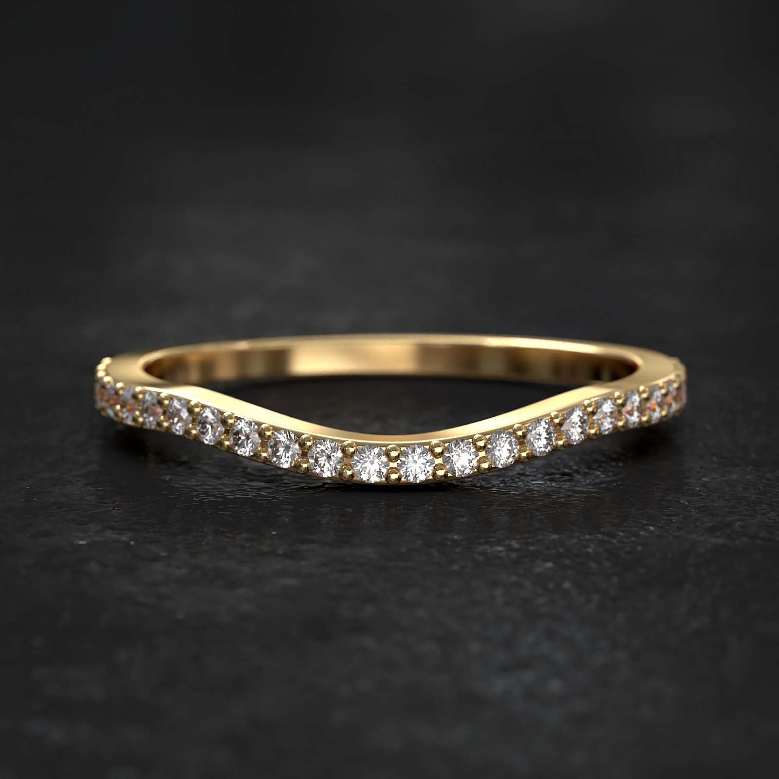 Curved half-eternity wedding band with lab-grown diamonds set in gold, featuring a sleek and modern design.