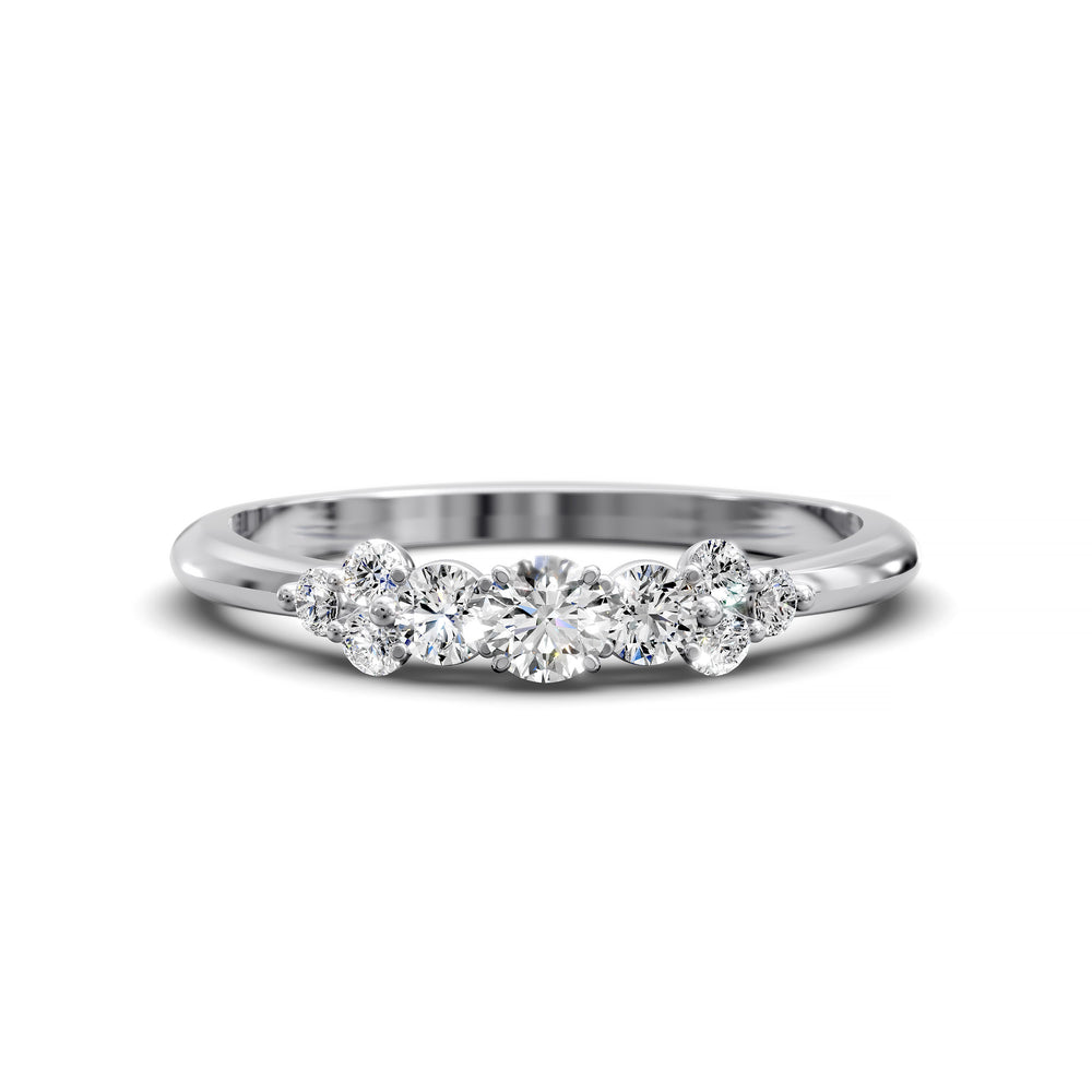 Dainty cluster diamond wedding band with floral-inspired design and tapered band