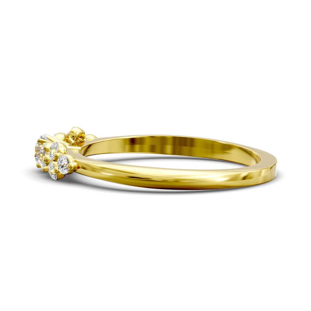 Dainty cluster diamond wedding band with floral-inspired design and tapered band