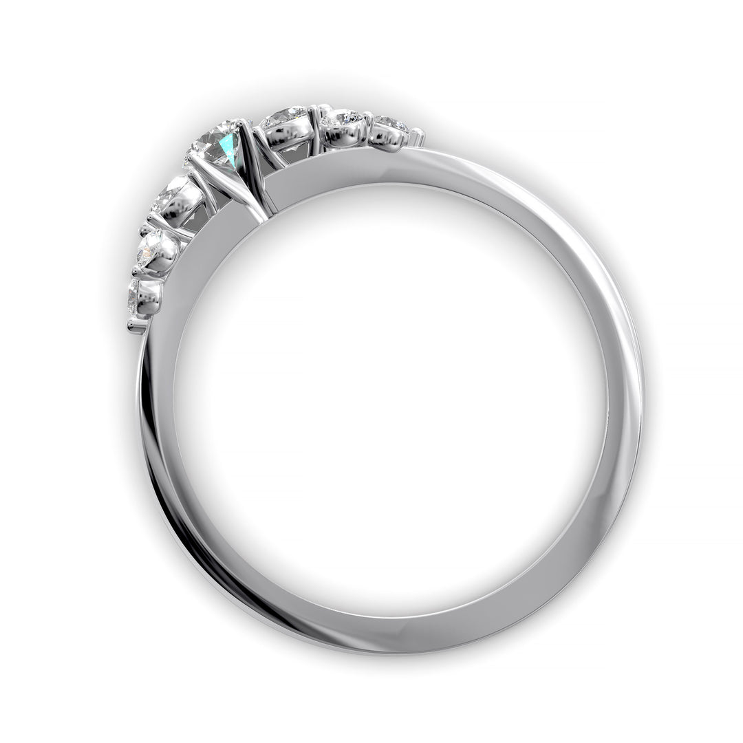 Dainty cluster diamond wedding band with floral-inspired design and tapered band