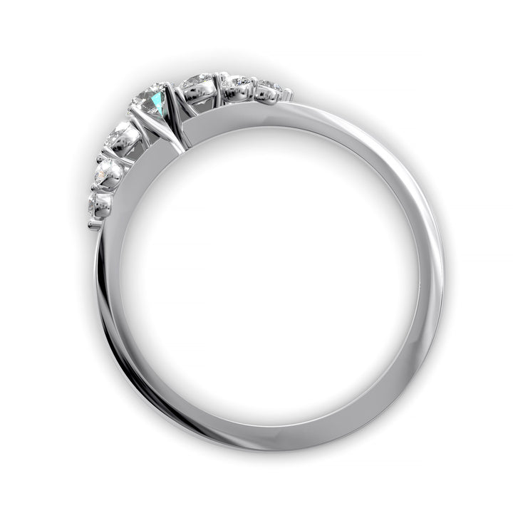 Dainty cluster diamond wedding band with floral-inspired design and tapered band