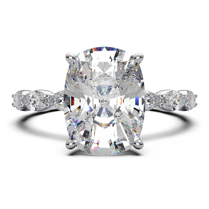 Low-setting engagement ring with 3.6 carat elongated cushion cut diamond and oval lab-grown diamond accents.