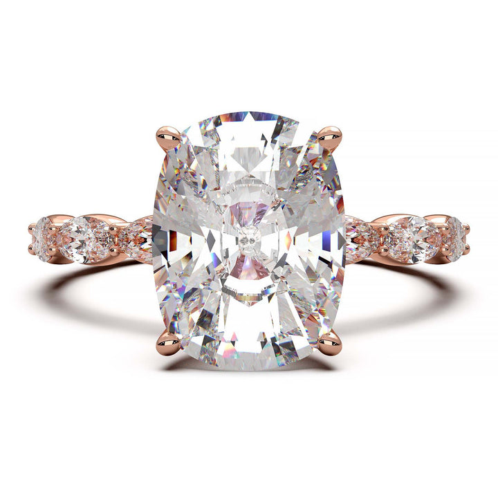 Low-setting engagement ring with 3.6 carat elongated cushion cut diamond and oval lab-grown diamond accents.