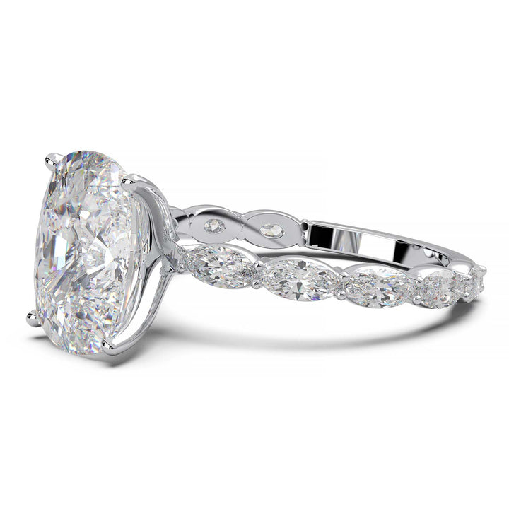 Low-setting engagement ring with 3.6 carat elongated cushion cut diamond and oval lab-grown diamond accents.