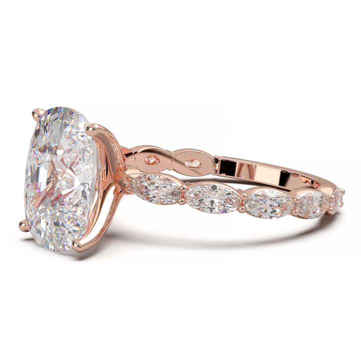 Low-setting engagement ring with 3.6 carat elongated cushion cut diamond and oval lab-grown diamond accents.