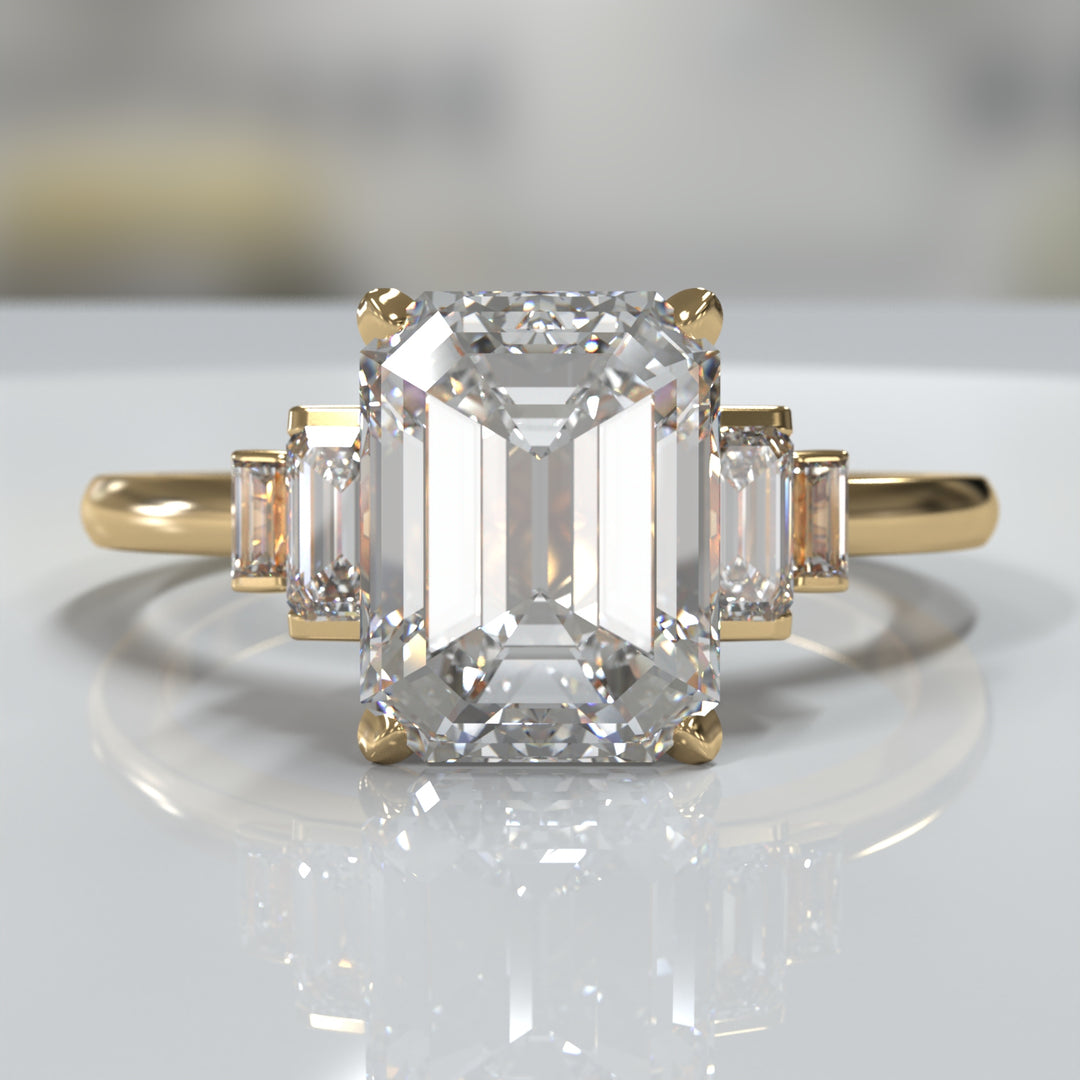 emerald-cut five-stone engagement ring with tapered baguette side diamonds shown from multiple angles