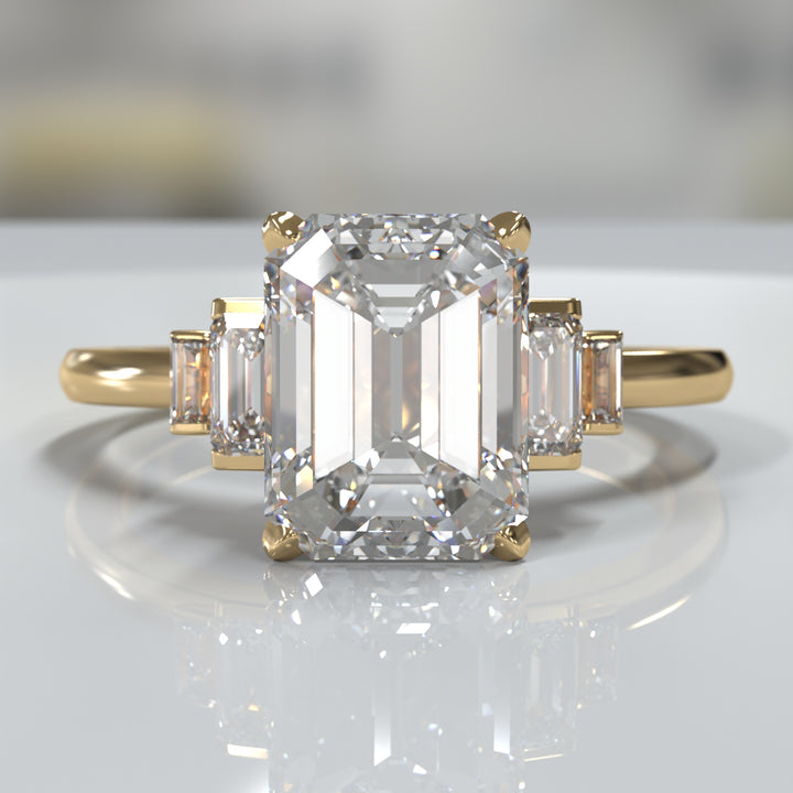emerald-cut five-stone engagement ring with tapered baguette side diamonds shown from multiple angles