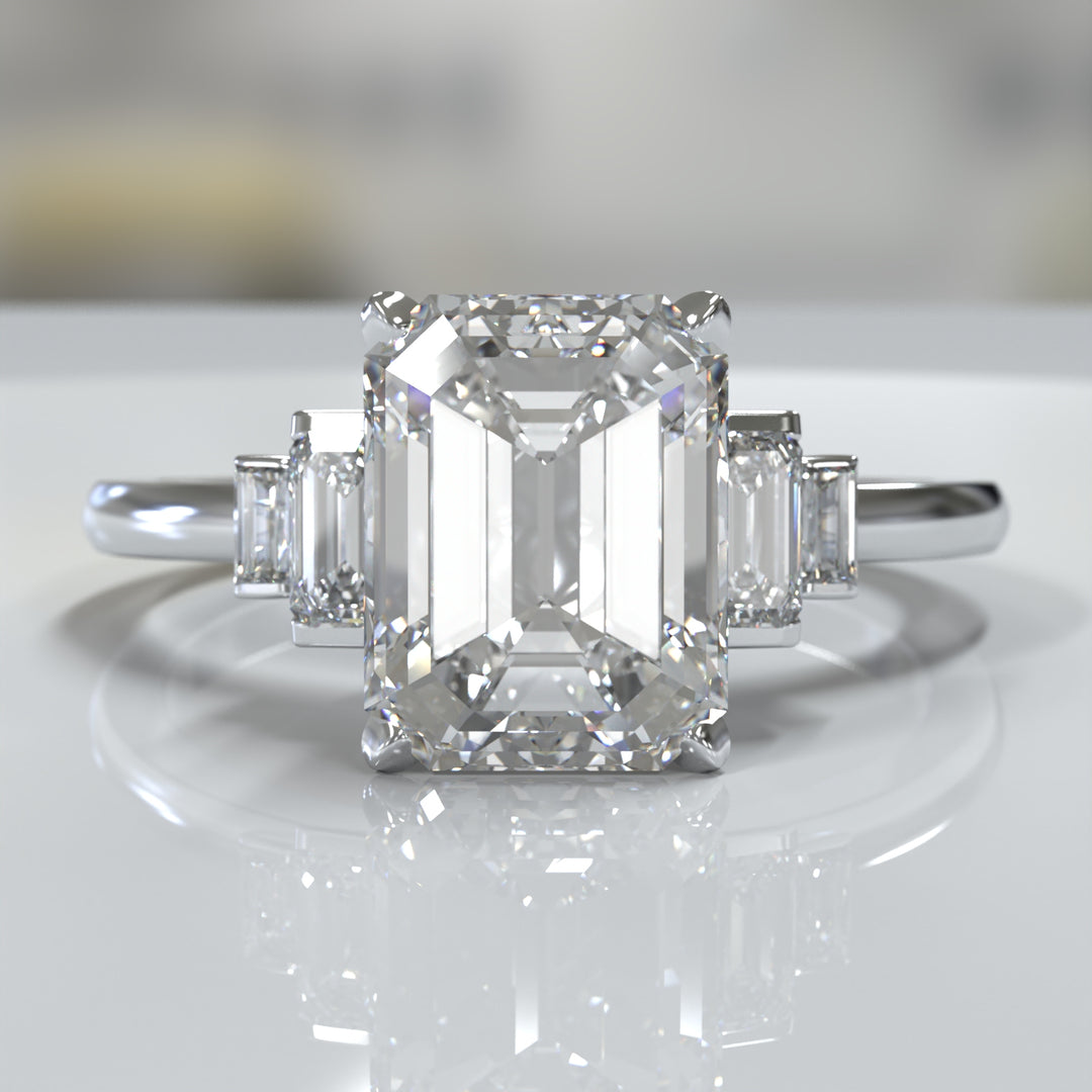 emerald-cut five-stone engagement ring with tapered baguette side diamonds shown from multiple angles