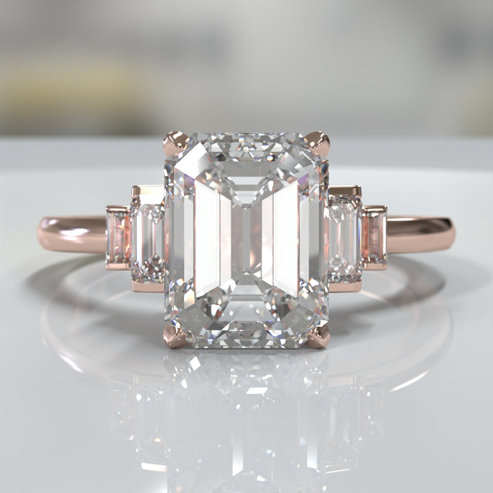 emerald-cut five-stone engagement ring with tapered baguette side diamonds shown from multiple angles